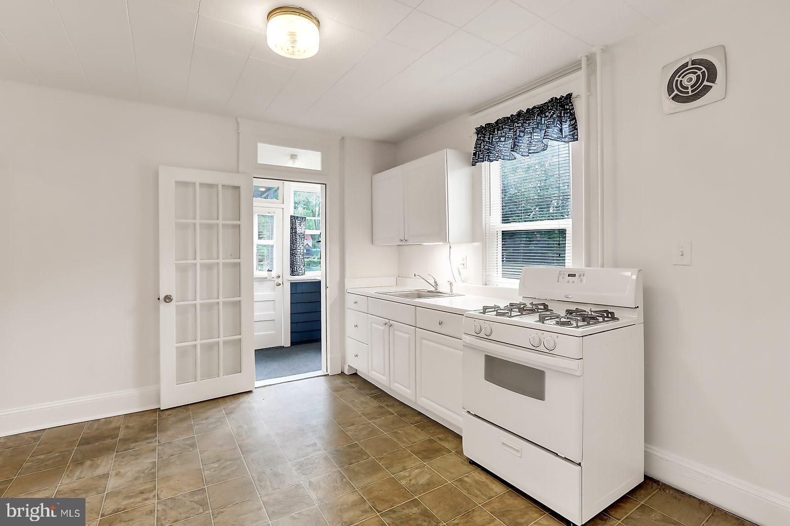 3525 St James Road Windsor Mill, MD 21244 - Photo 6 of 27 a kitchen with a stove and a refrigerator