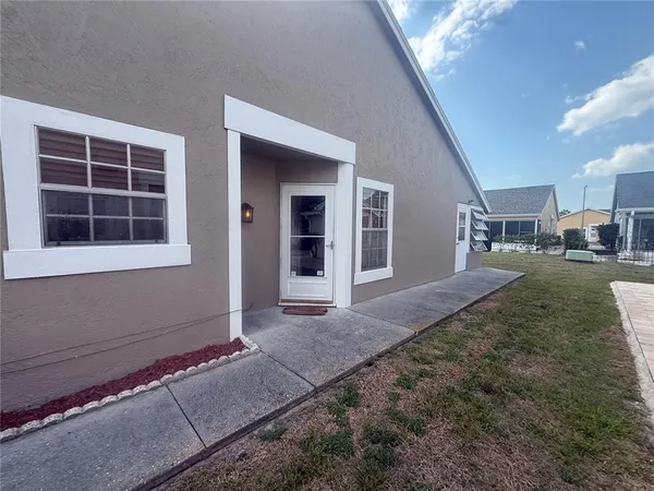 a view of a house with a yard and garage