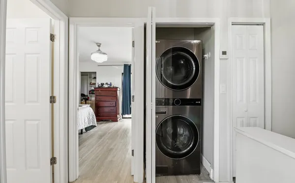 a view of a hallway with washer and dryer