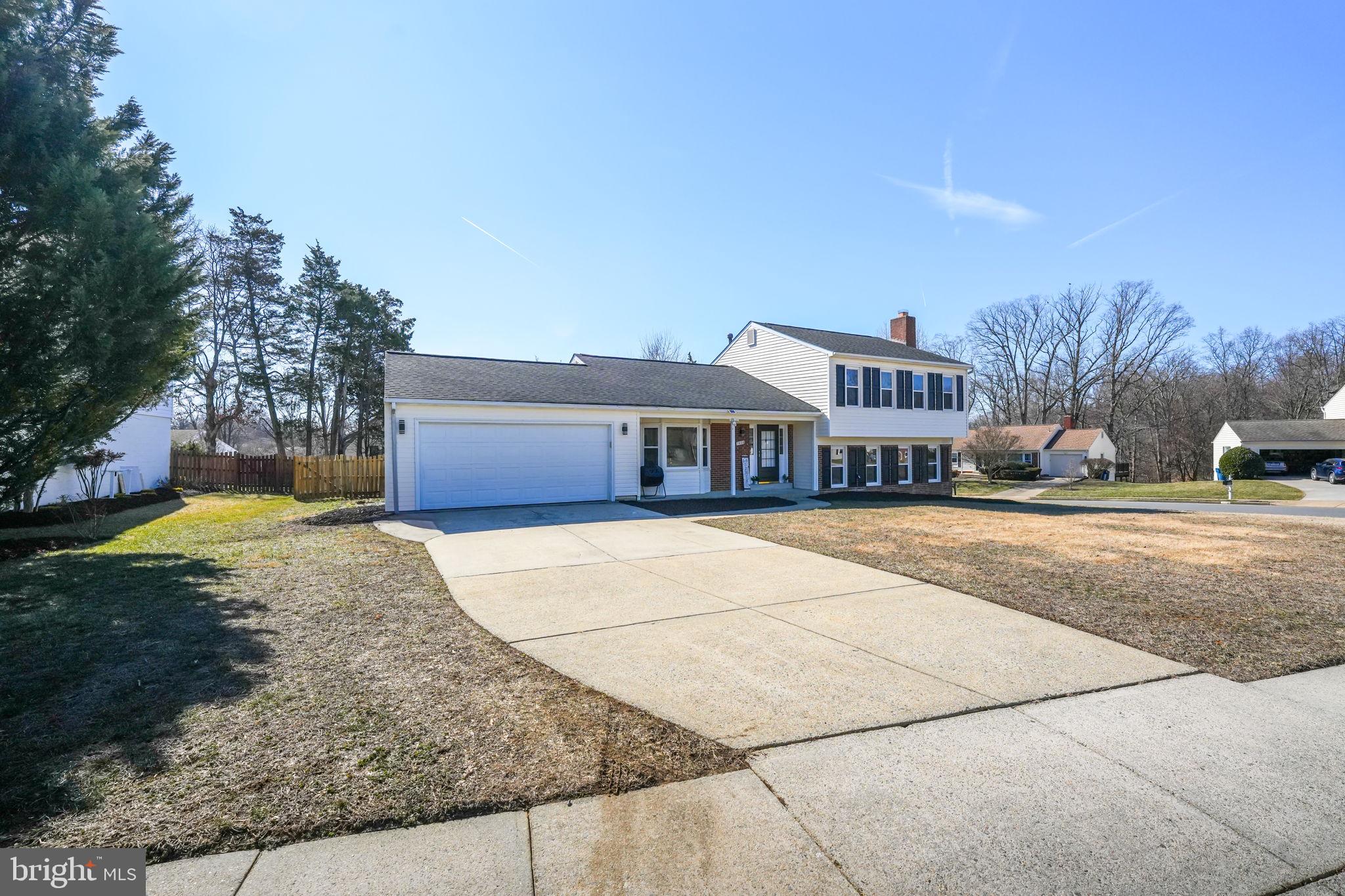7829 Richfield Road Springfield, VA 22153 - Photo 2 of 34 a front view of a house with a yard and garage