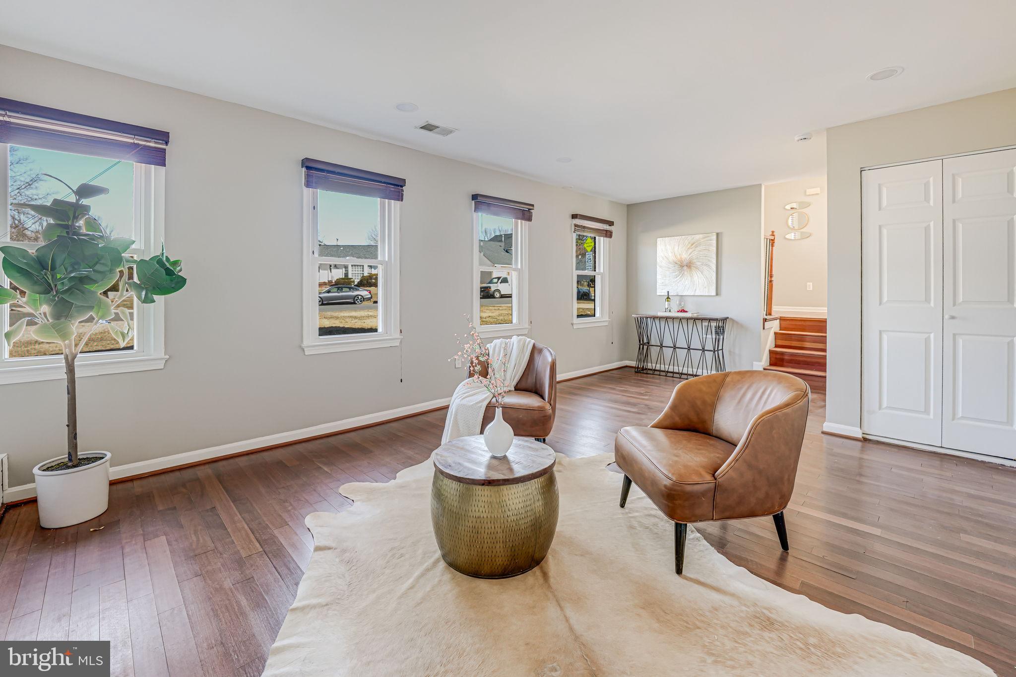 7829 Richfield Road Springfield, VA 22153 - Photo 27 of 34 a living room with furniture and a wooden floor