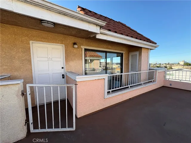a view of balcony with wooden floor