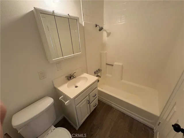 a bathroom with a sink toilet and tub