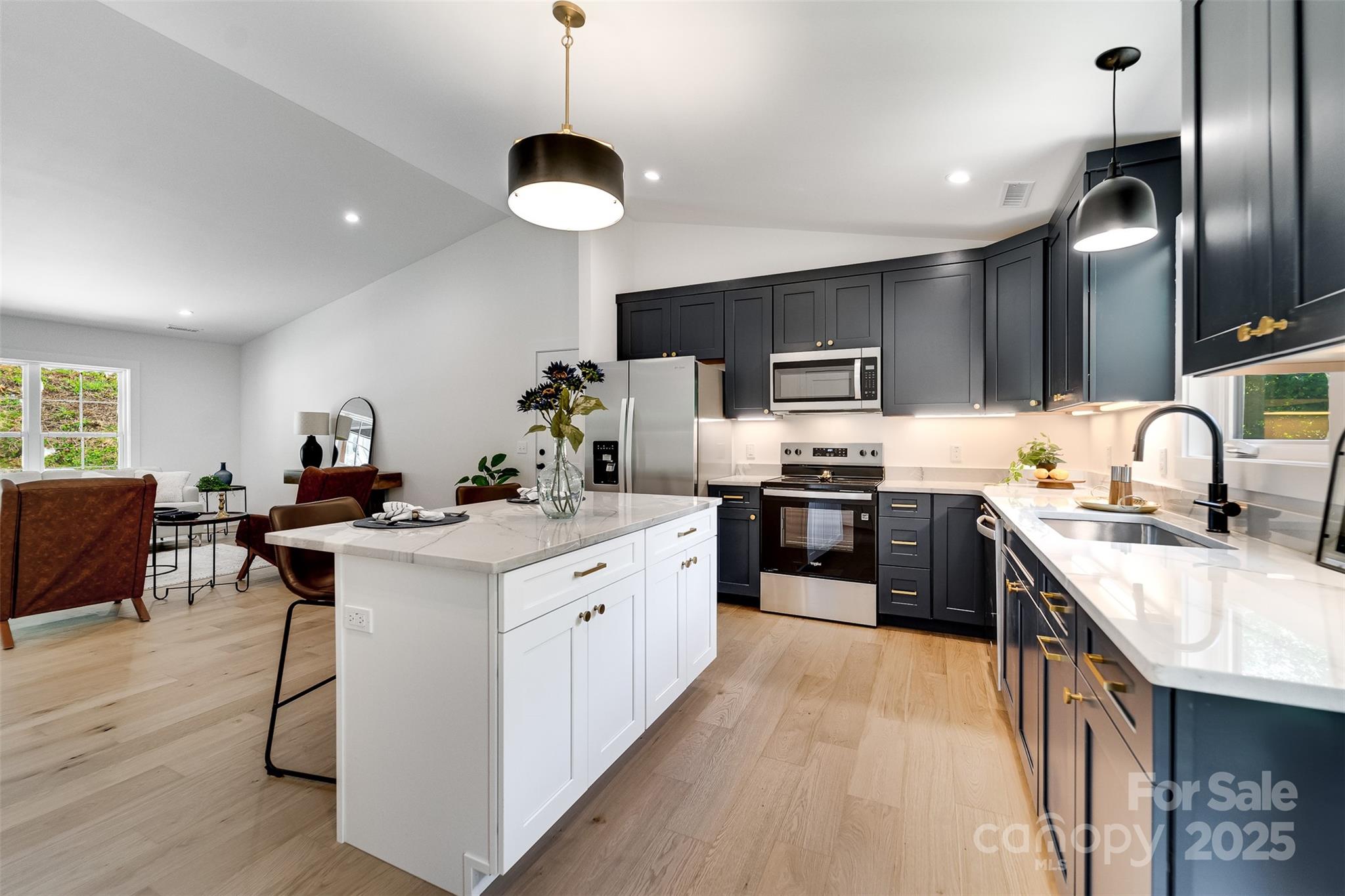 22 Crossing Lane Sylva, NC 28779 - Photo 12 of 44 a kitchen with stainless steel appliances granite countertop a sink a stove and a refrigerator