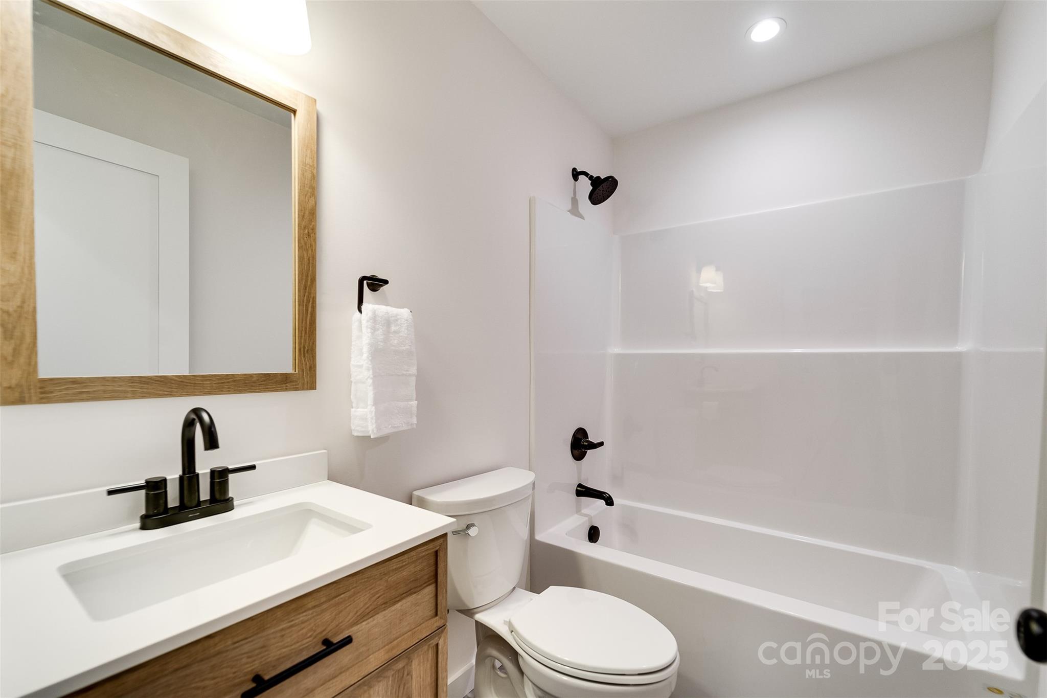 22 Crossing Lane Sylva, NC 28779 - Photo 18 of 44 a bathroom with a sink a toilet and a bathtub