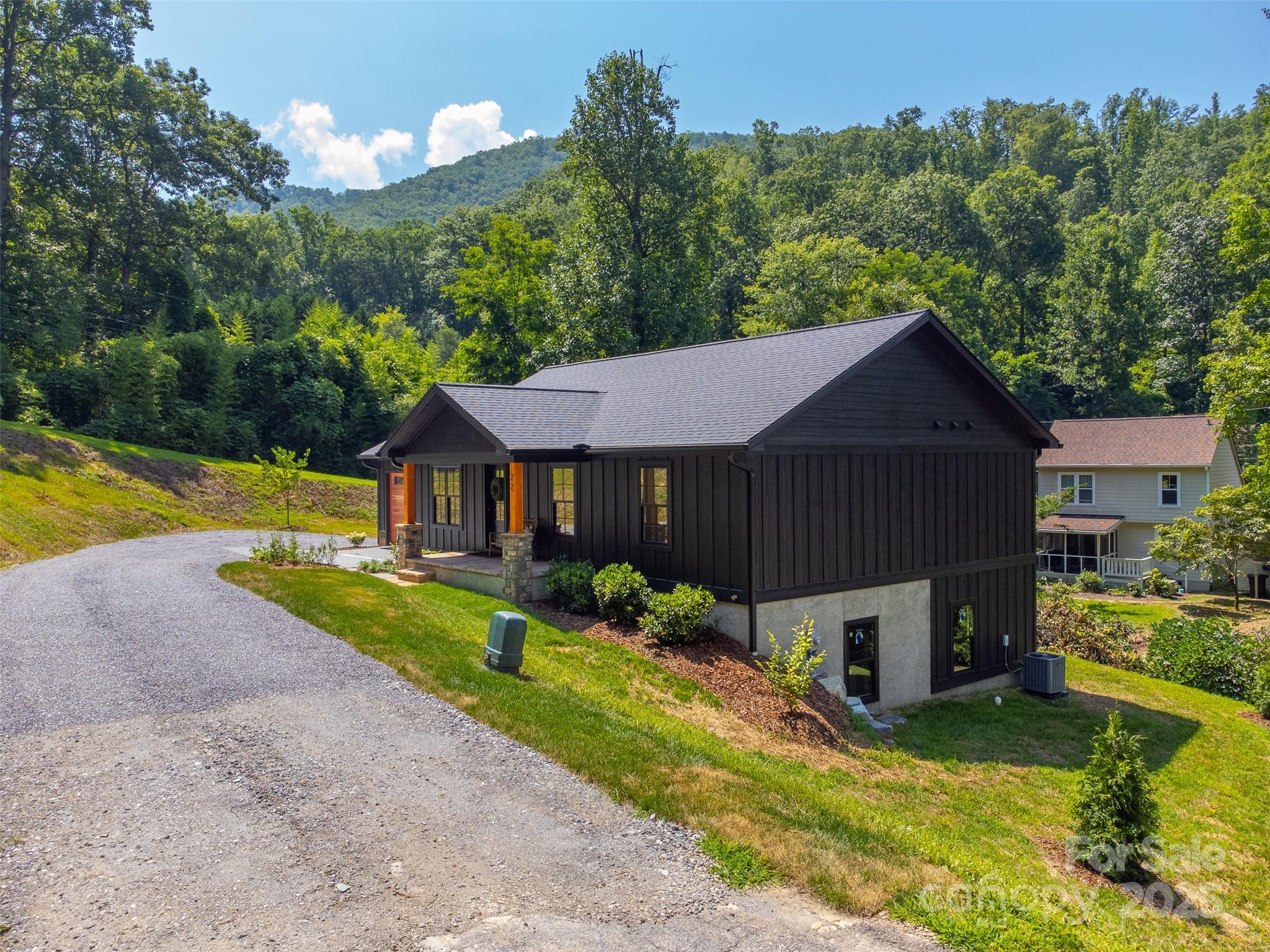 22 Crossing Lane Sylva, NC 28779 - Photo 2 of 44 a aerial view of a house with swimming pool and a yard