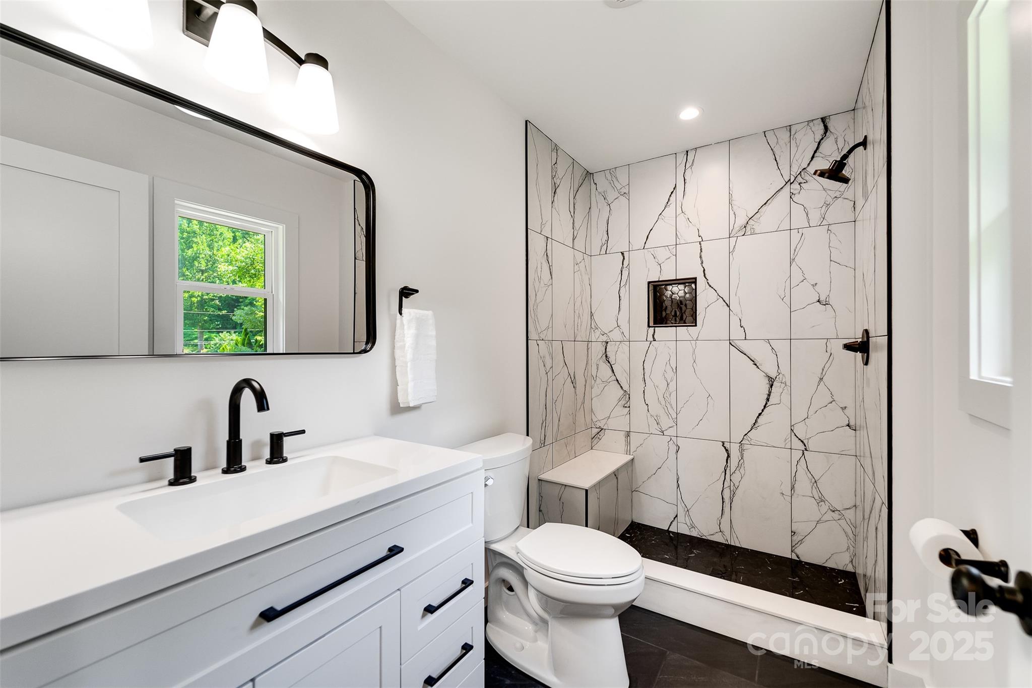 22 Crossing Lane Sylva, NC 28779 - Photo 23 of 44 a bathroom with a sink toilet and shower