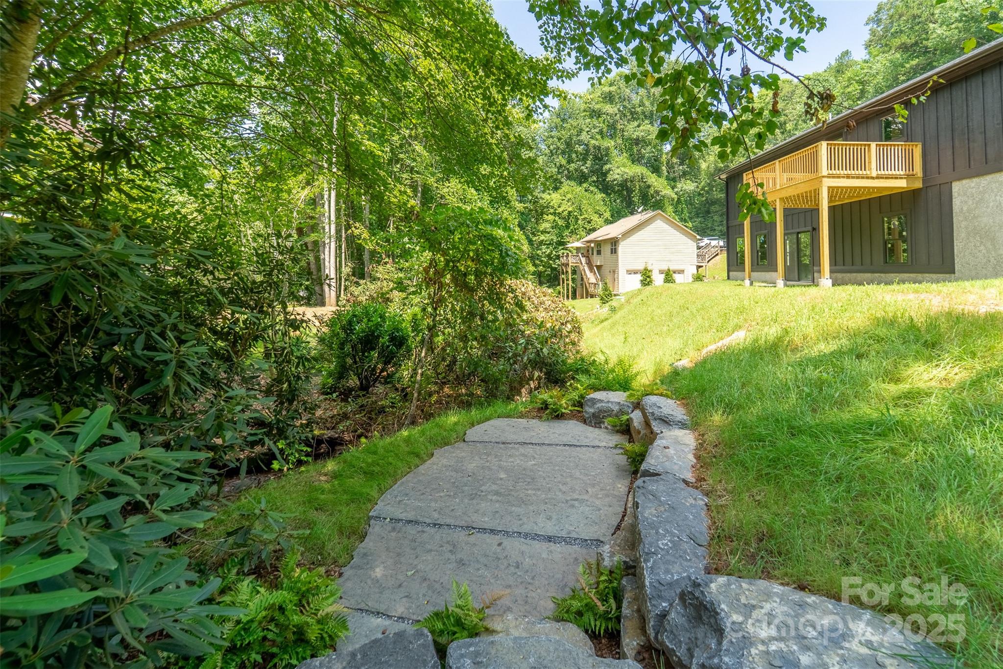 22 Crossing Lane Sylva, NC 28779 - Photo 36 of 44 a view of a house with a yard and large tree