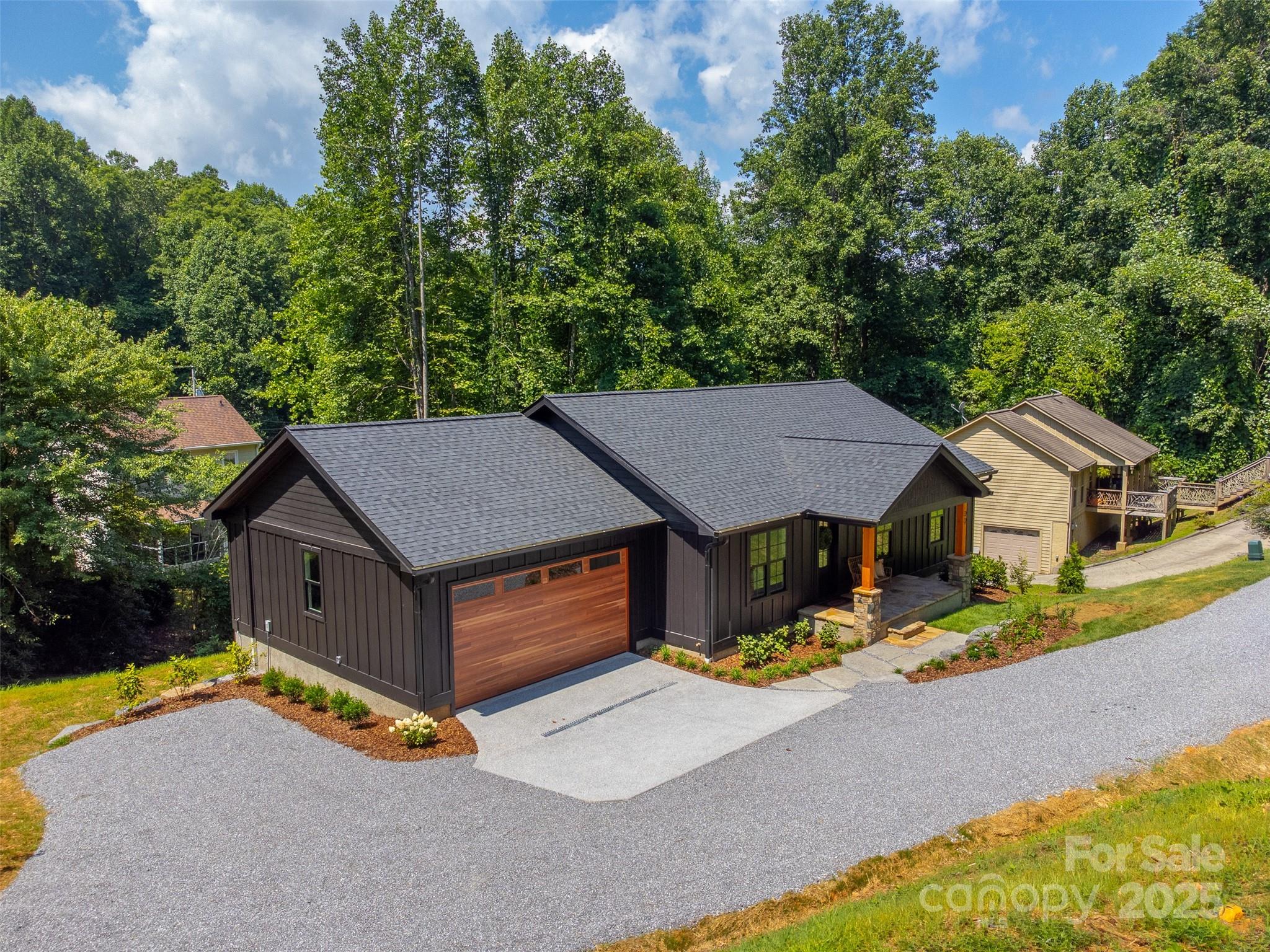 22 Crossing Lane Sylva, NC 28779 - Photo 4 of 44 a house with a large pool in front of it