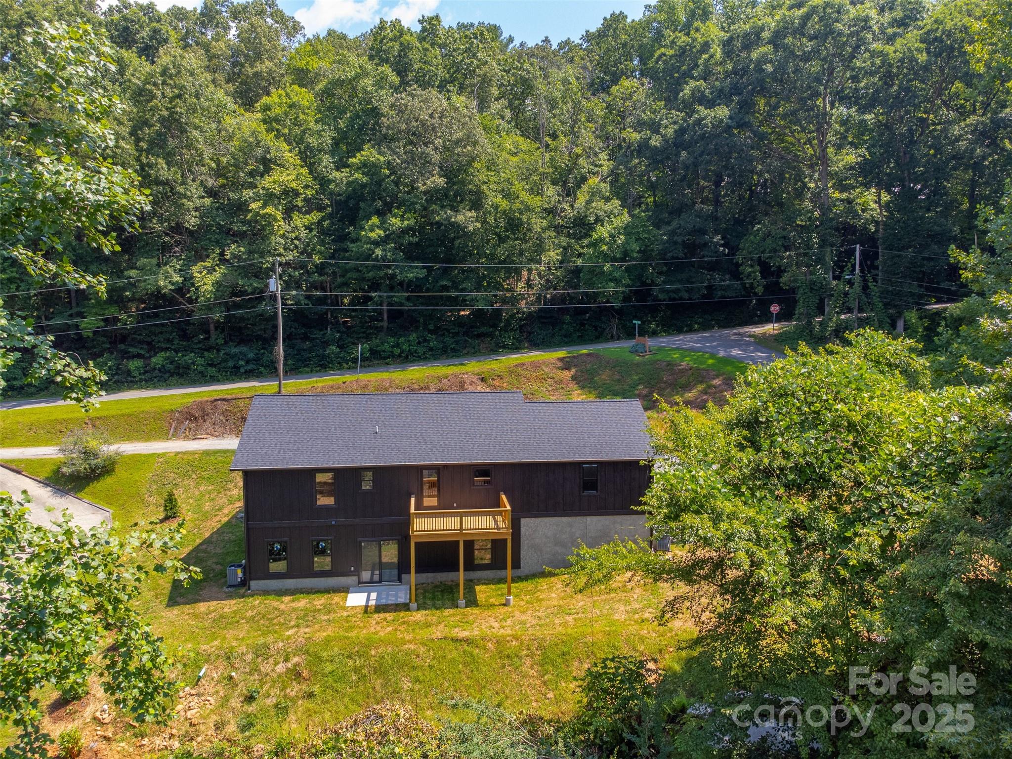 22 Crossing Lane Sylva, NC 28779 - Photo 44 of 44 a view of swimming pool with lawn chairs and plants