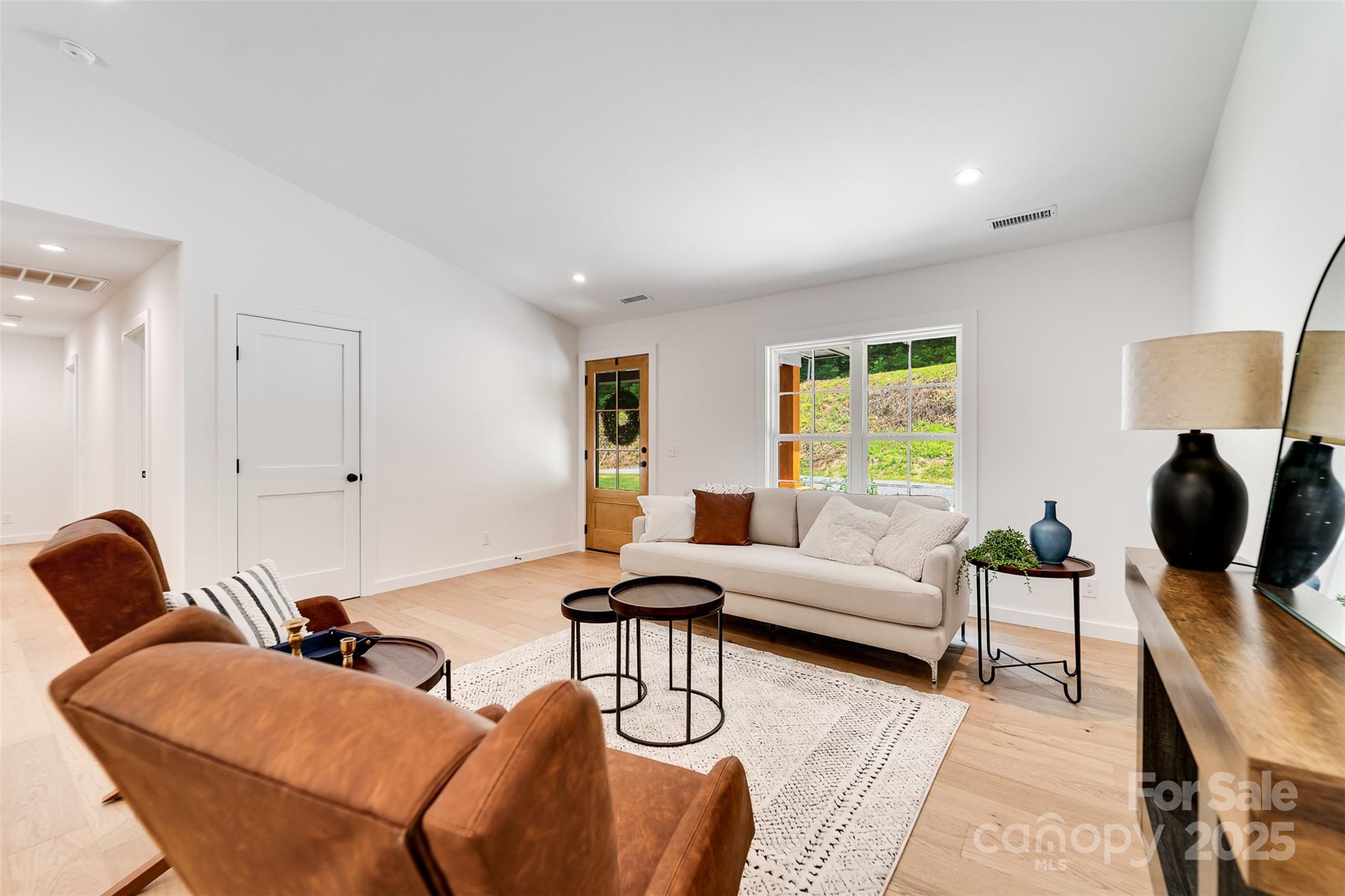 22 Crossing Lane Sylva, NC 28779 - Photo 7 of 44 a living room with furniture or couch and a large window