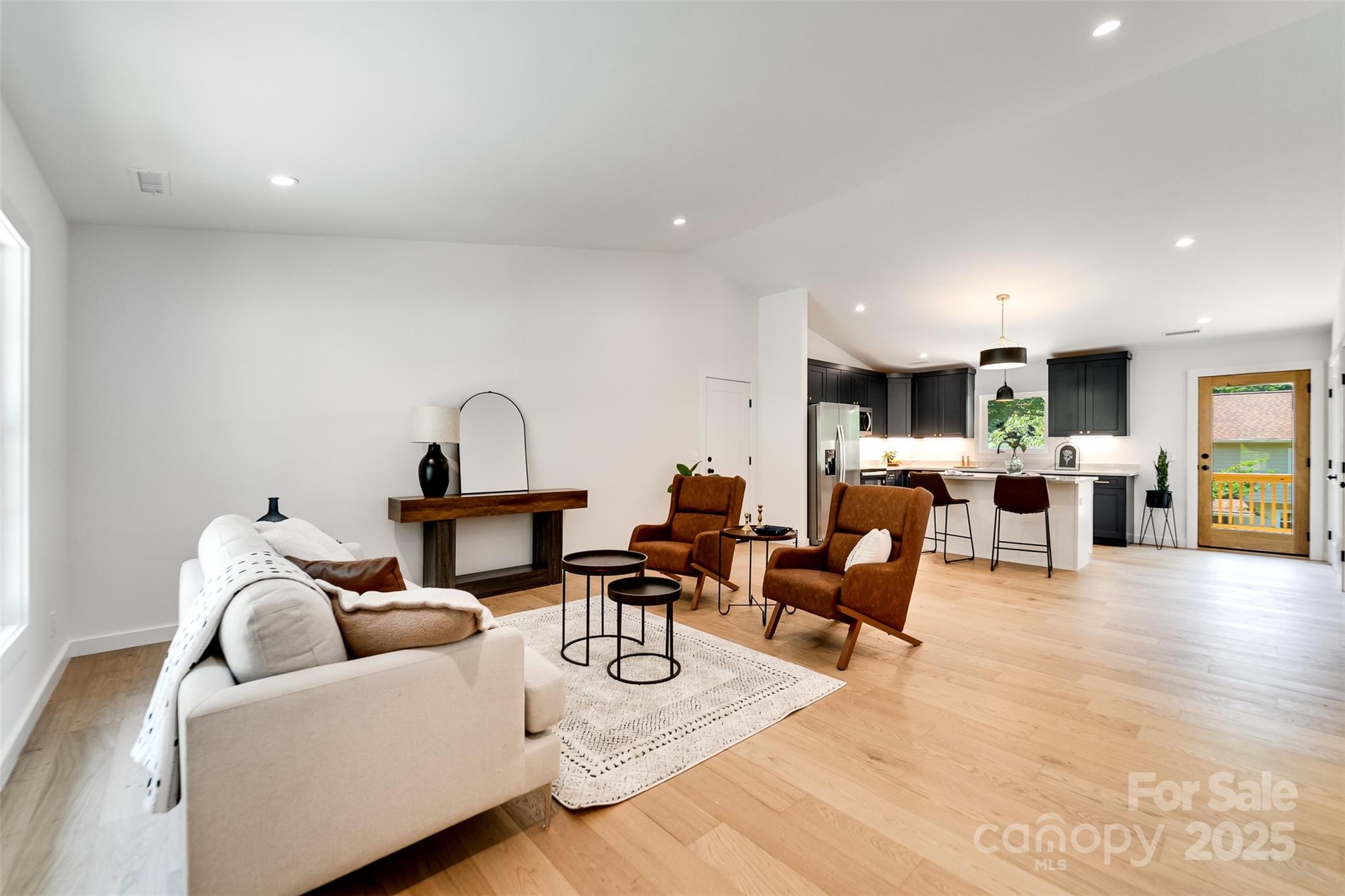 22 Crossing Lane Sylva, NC 28779 - Photo 8 of 44 a living room with furniture and kitchen view
