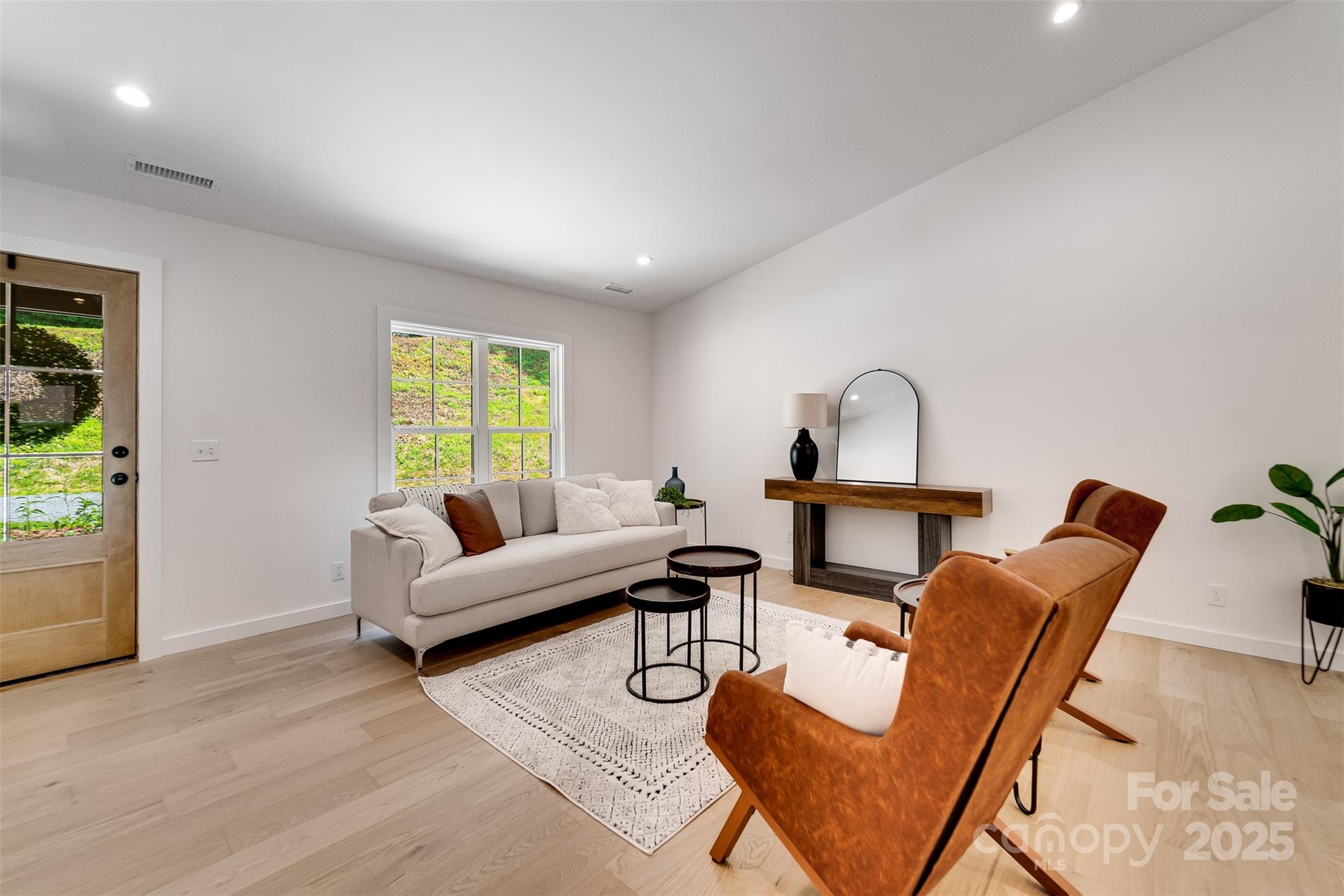 22 Crossing Lane Sylva, NC 28779 - Photo 10 of 44 a living room with furniture and a window