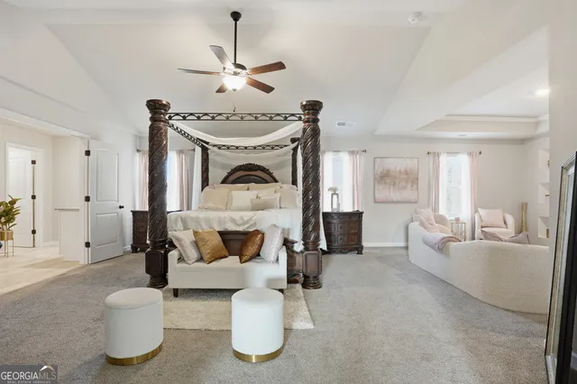 a living room with furniture and a large mirror