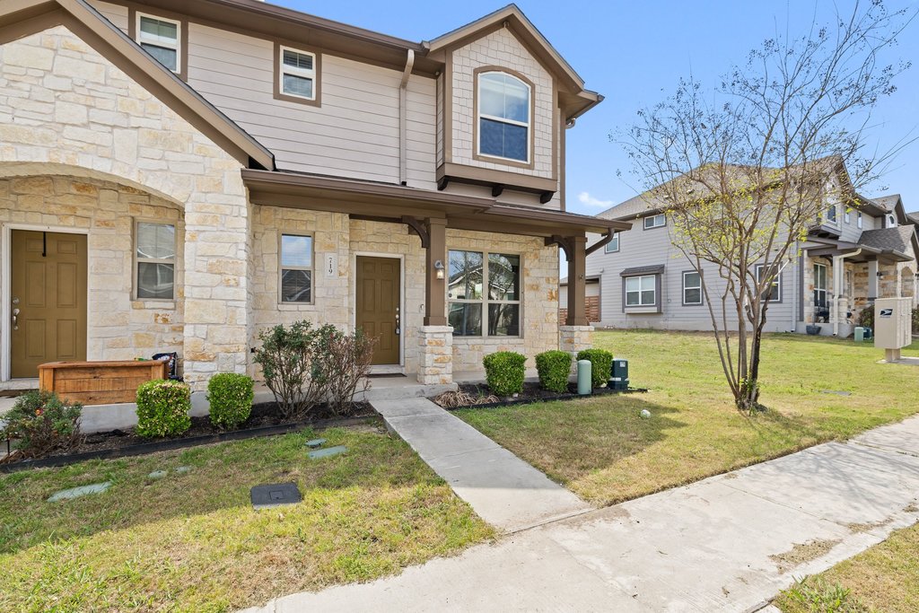 719 Coconut Grove Street Pflugerville, TX 78660 - Photo 2 of 31 a front view of a house with garden