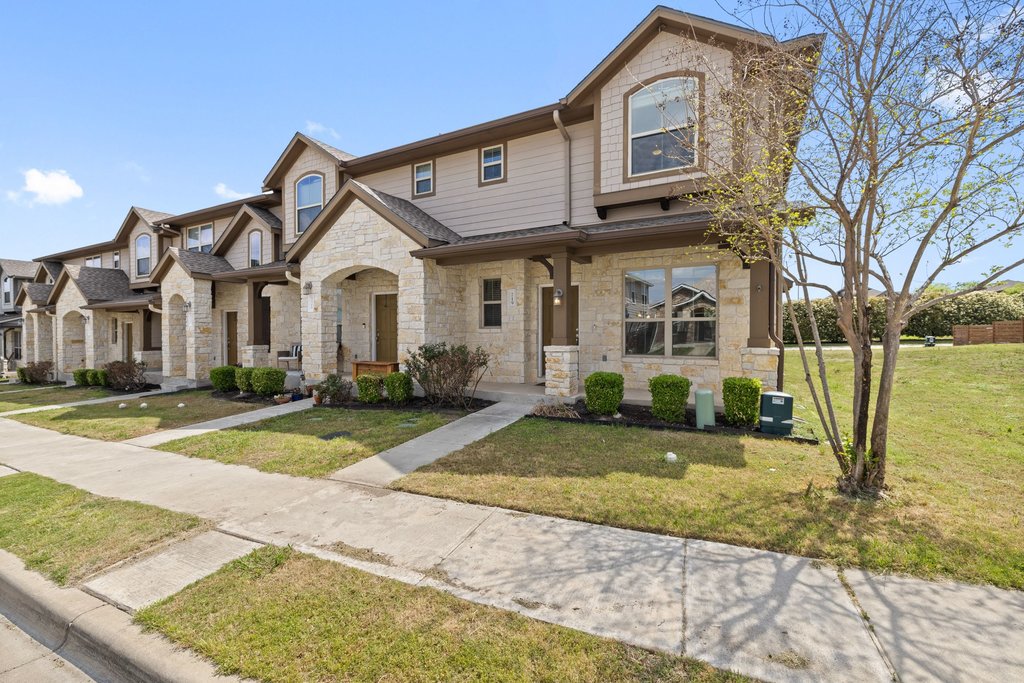 719 Coconut Grove Street Pflugerville, TX 78660 - Photo 3 of 31 a front view of a house with a yard and garage