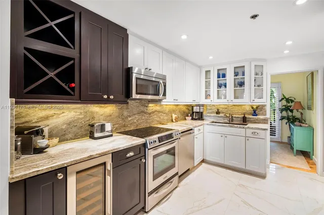 a living room with furniture large windows and a rug