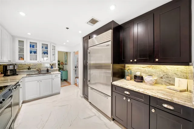 a front view of a residential apartment building with a yard