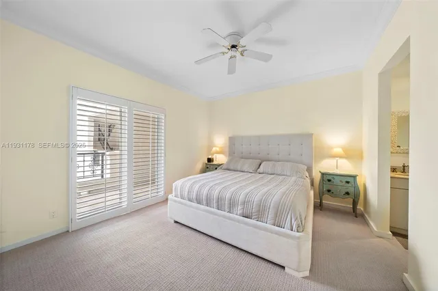 a view of a patio with table and chairs potted plants and large tree
