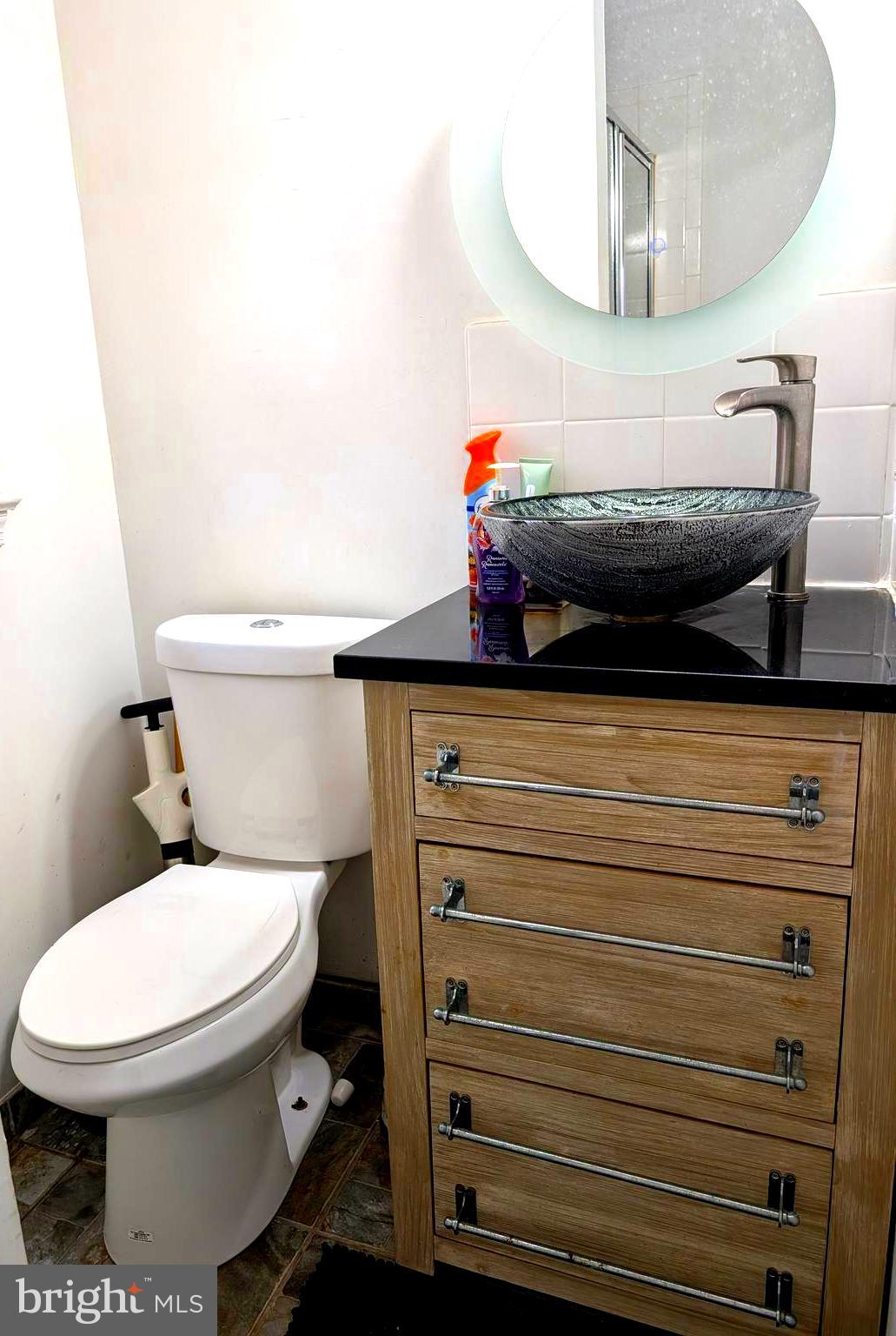 12816 Valleywood Drive Silver Spring, MD 20906 - Photo 11 of 20 a bathroom with a toilet and a mirror