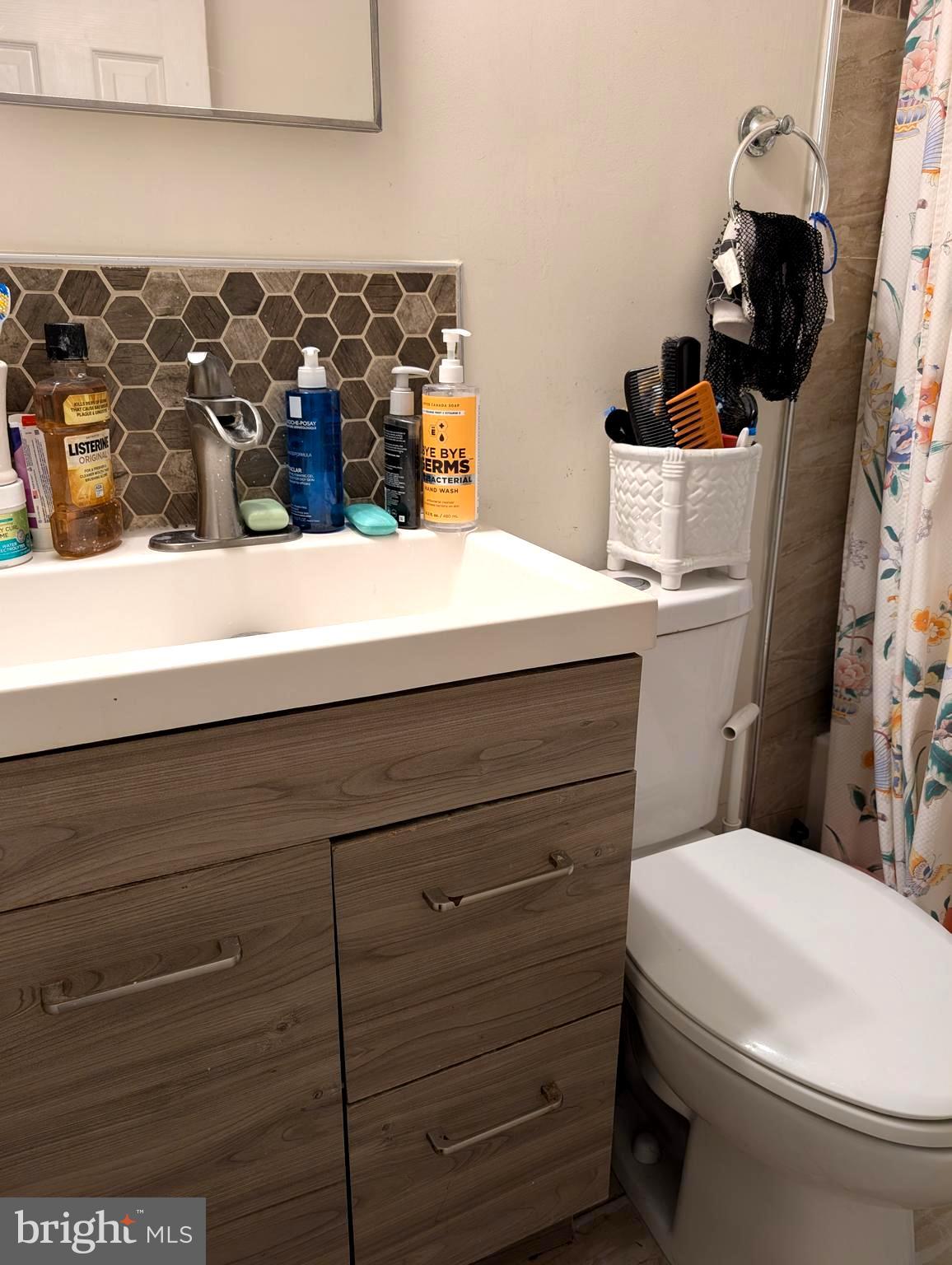 12816 Valleywood Drive Silver Spring, MD 20906 - Photo 16 of 20 a bathroom with a sink and a toilet