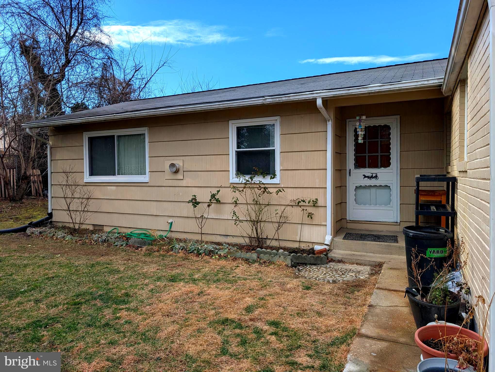 12816 Valleywood Drive Silver Spring, MD 20906 - Photo 17 of 20 a front view of a house with garden
