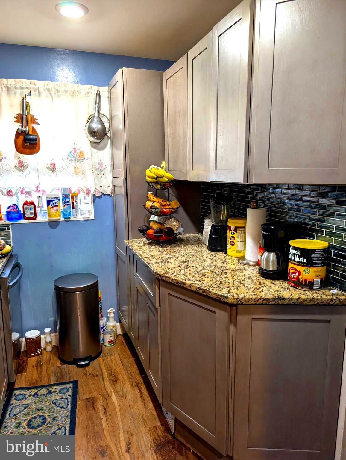 12816 Valleywood Drive Silver Spring, MD 20906 - Photo 9 of 20 a kitchen with a sink and a stove top oven