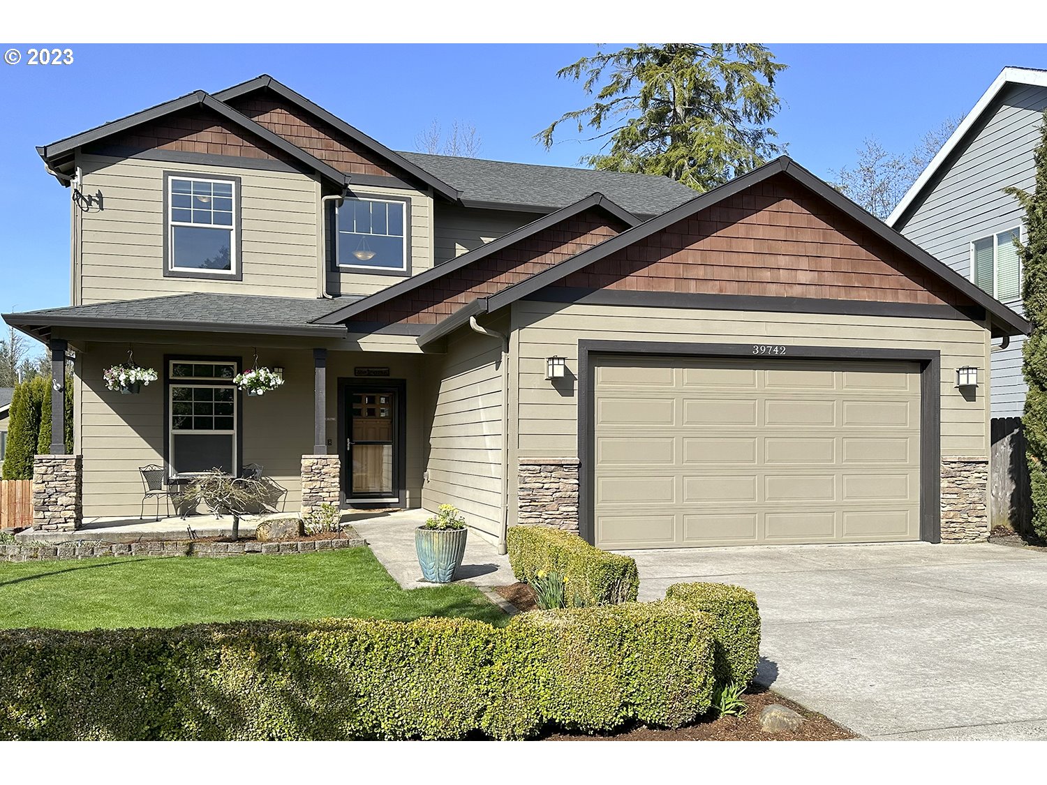 a front view of a house with garden