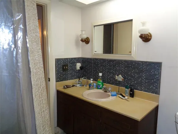 a bathroom with a sink and a mirror