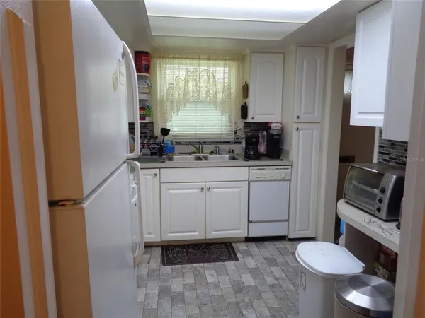 a bathroom with a sink toilet and mirror