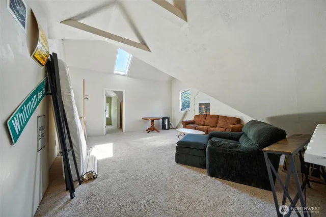 a living room with furniture and a rug
