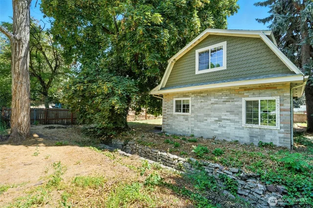 a kitchen with granite countertop cabinets a dining table and chairs