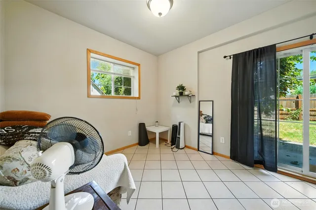 a bedroom with a bed and wooden door