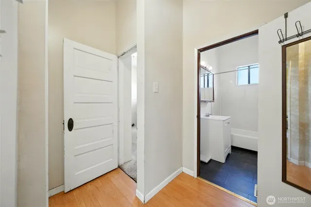 a view of a bathroom with a sink and a mirror