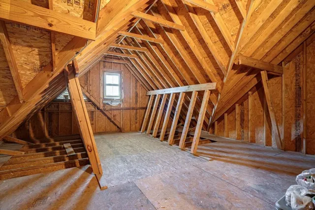 a balcony with wooden floor and outdoor space