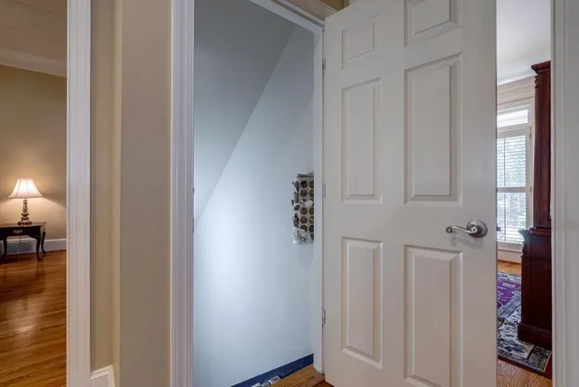 a balcony with wooden floor and fence