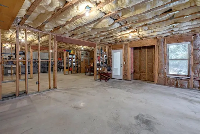 a view of a patio with table and chairs and potted plants