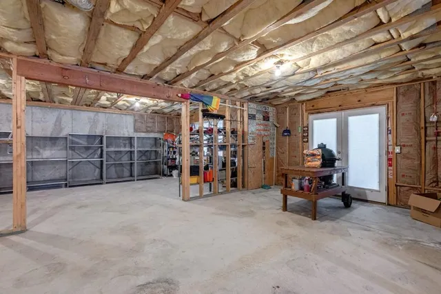 a view of a backyard with plants and a garden