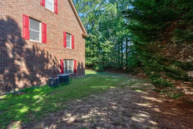 a backyard of a house with lots of green space