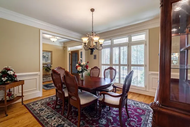 a large kitchen with stainless steel appliances granite countertop a stove refrigerator and cabinets