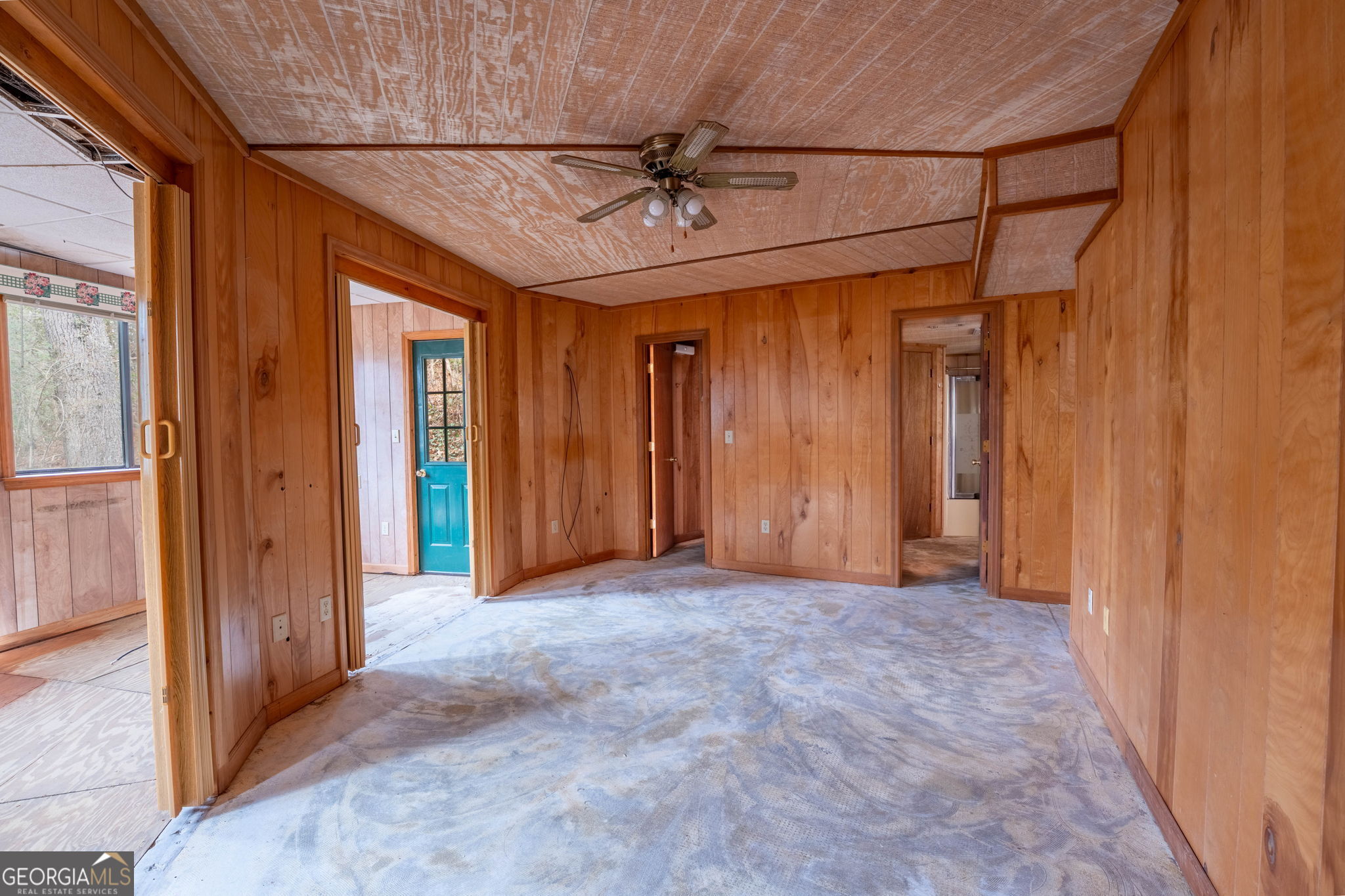 159 Clare Lane Rabun Gap, GA 30568 - Photo 13 of 41 an empty room with a ceiling fan