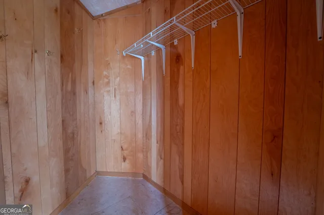 a view of an empty room with windows