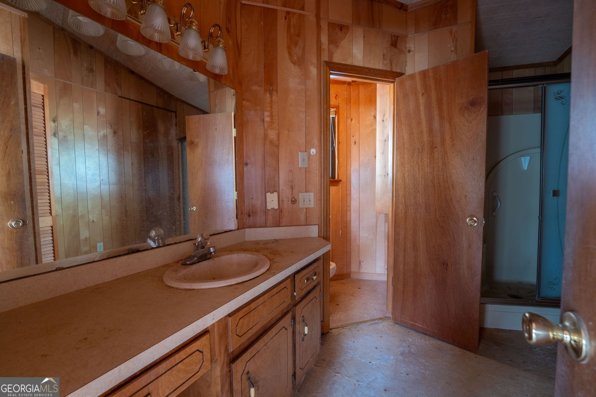 159 Clare Lane Rabun Gap, GA 30568 - Photo 17 of 41 a bathroom with a sink and a mirror