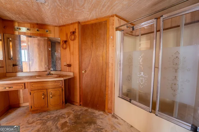 a view of a kitchen with a large window