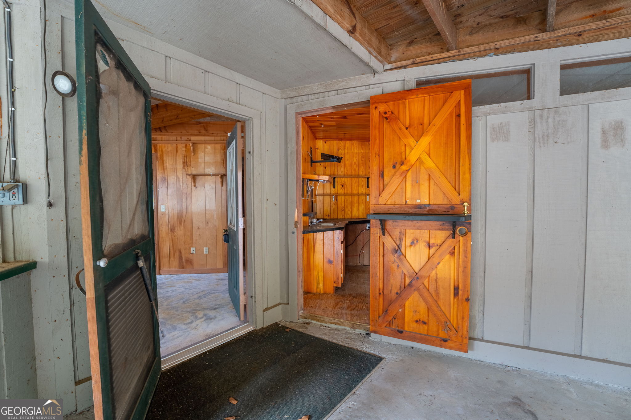 159 Clare Lane Rabun Gap, GA 30568 - Photo 28 of 41 an empty room with wooden floor and windows