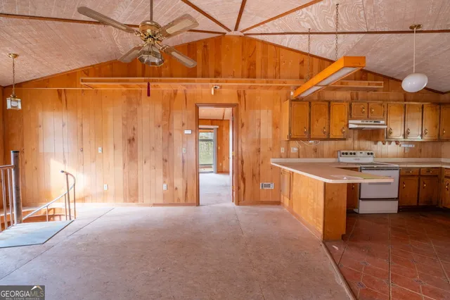 a kitchen with a sink cabinets and appliances