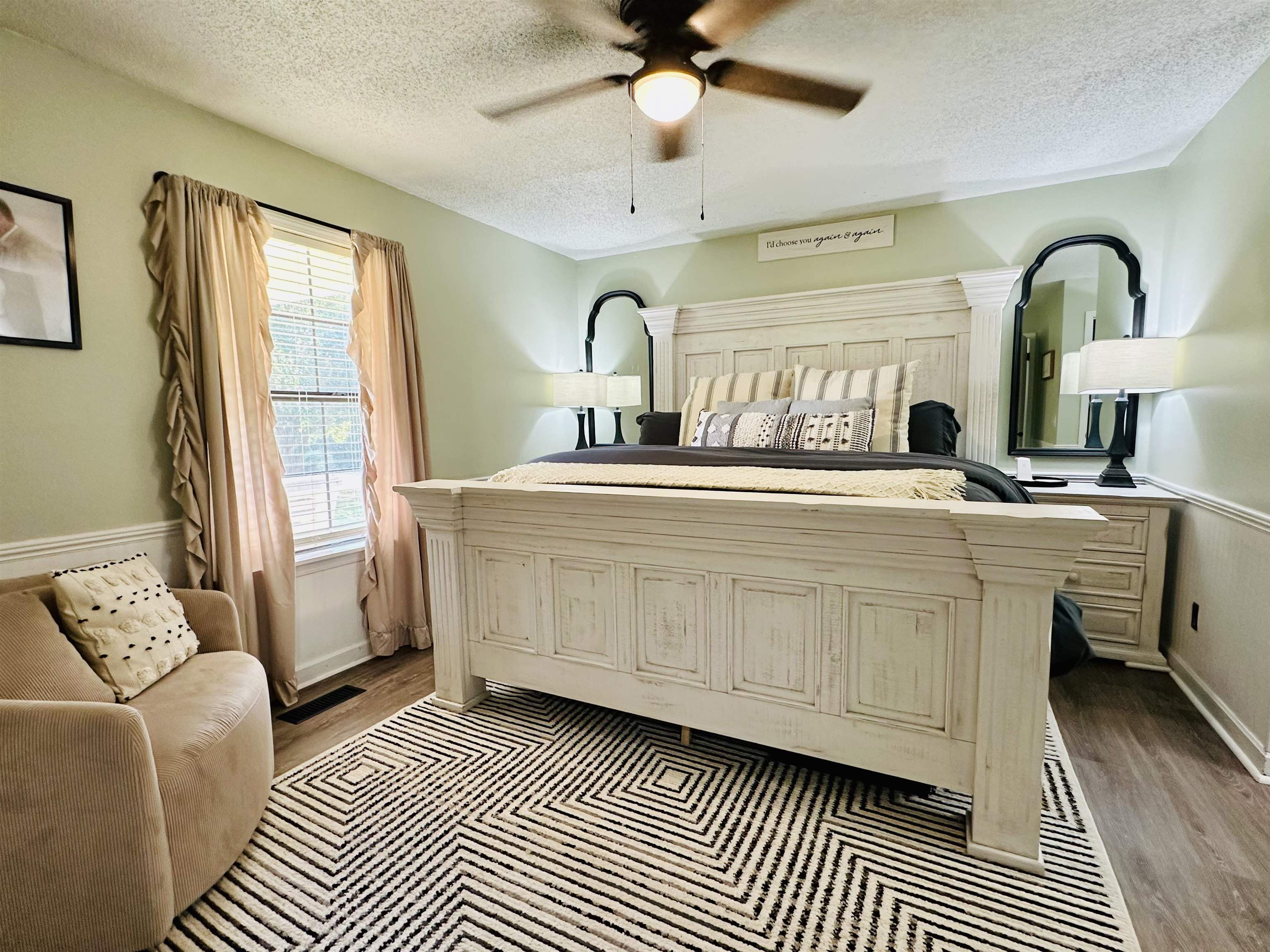 7120 Powell Chapel Road Hornsby, TN 38044 - Photo 12 of 29 a bedroom with a bed and a chandelier