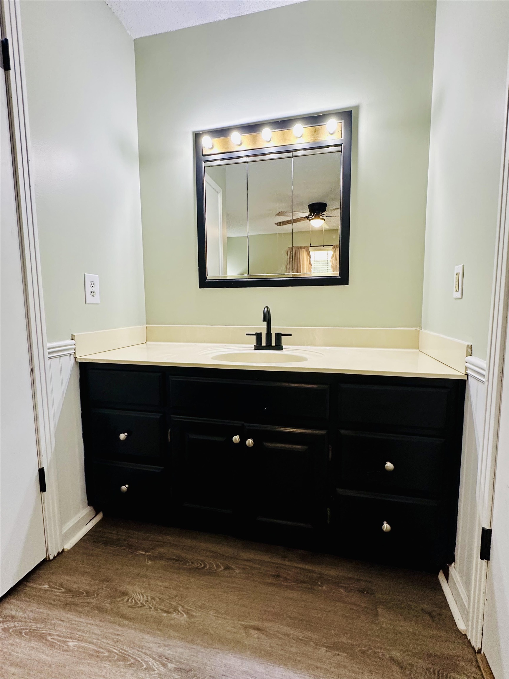 7120 Powell Chapel Road Hornsby, TN 38044 - Photo 13 of 29 a bathroom with a sink vanity and a mirror
