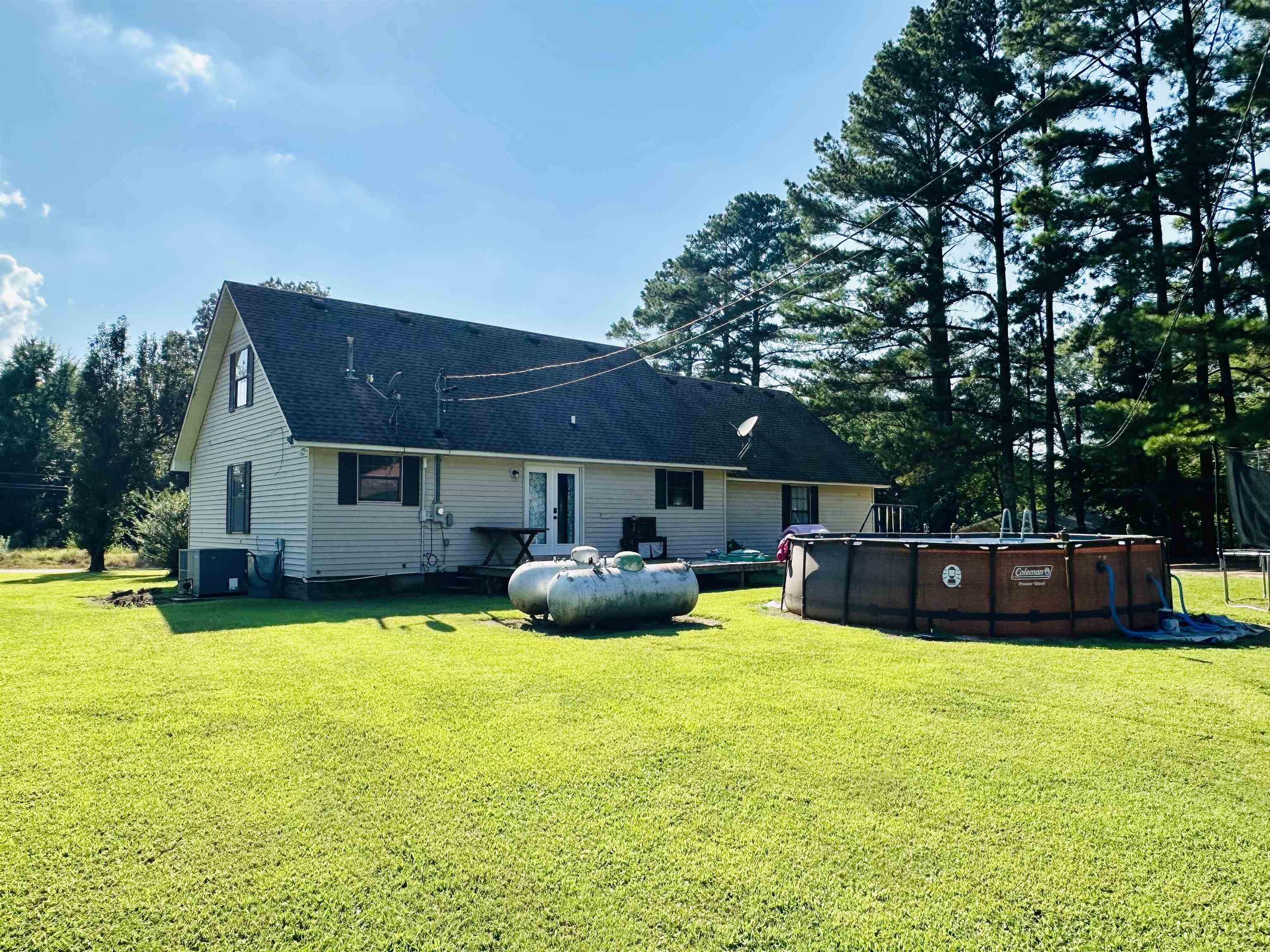 7120 Powell Chapel Road Hornsby, TN 38044 - Photo 24 of 29 a view of a house with swimming pool and sitting area