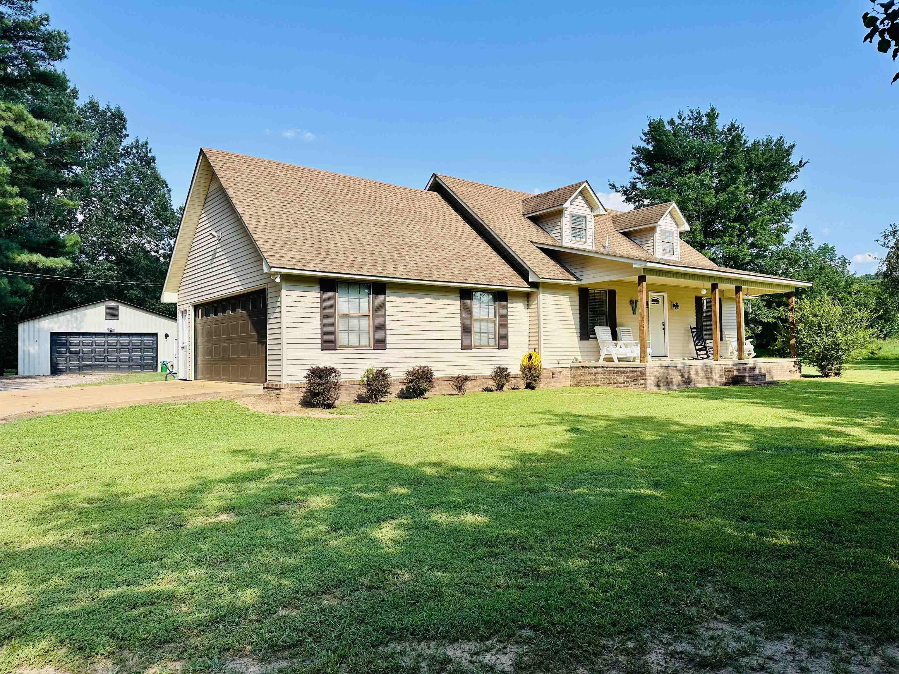7120 Powell Chapel Road Hornsby, TN 38044 - Photo 27 of 29 a front view of a house with a garden